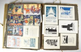 Album of greetings cards including woodcut and similar examples, many with artsist's name in pencil,