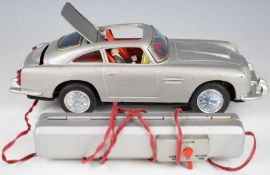 James Bond Aston Martin DB5 Japanese battery operated tinplate car, with remote control.