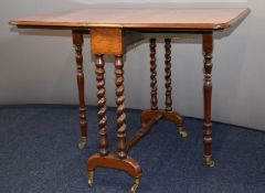 Burr walnut Sutherland table raised on mahogany base and brass castors, 75 x 94 when extended x