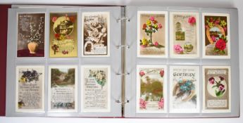 Two postcard albums, one with approximately 174 Edwardian era birthday cards including cats and dogs