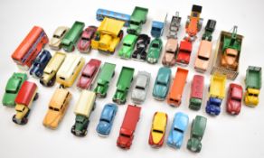 Forty Dinky diecast model cars and trucks including early examples.