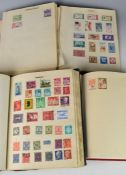 An accumulation of GB and world stamps and first day covers in various albums, folders and boxes