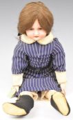 Goss English bisque headed doll marked GOSS 21 on shoulders, with cloth body, fixed blue eyes,