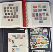 A collection of GB and world stamps in various albums and folders including France, USA, Belgium