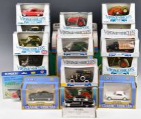 A collection of Ertl diecast vintage vehicles and tractors, in original boxes.
