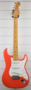 Fender Stratocaster vintage series electric guitar in custom orange, with maple neck and