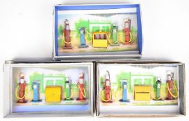 Three loose Dinky Toys diecast model Petrol Pump set number 49.