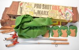 Two Pro Shot Golf toys by Marx to include two clubs with mechanical swing action, golfer, green,
