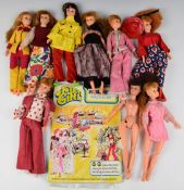 Nine Palitoy Action Girl dolls with original clothing and backing card.
