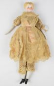 Victorian parian style doll with stuffed body, moulded blonde hair, blue eyes, pink tinted cheeks,