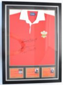 Wales International rugby shirt signed by Phil Bennett, Gareth Edwards and JPR Williams, framed with