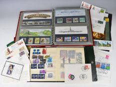 A modern GB stamp collection in presentation packs and first day covers, contained in seven