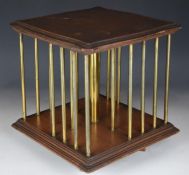 Mahogany and brass revolving bookcase, with plaque to base giving registered design number 245908,