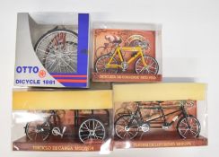 Four 1:10 scale diecast model bicycles and similar, all in original boxes.