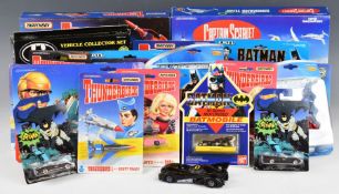 A collection of early 90's Matchbox, Ertl and similar diecast model cars, franchises include Batman,