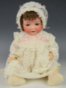 Heubach Kopperldorf bisque headed doll with blue weighted eyes, open mouth, blushing cheeks,