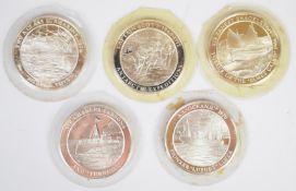 Five hallmarked silver medallions commemorating famous explorers / vessels including Captain Scott