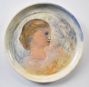 Reg Gammon (1894-1997) hand painted ceramic plate Head of a Young Woman, initialled to front RG