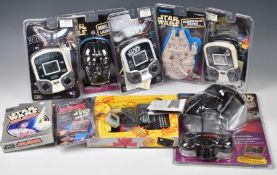 A collection of Star Wars handheld LCD games by Tiger and MGA, together with a Star Wars Jedi