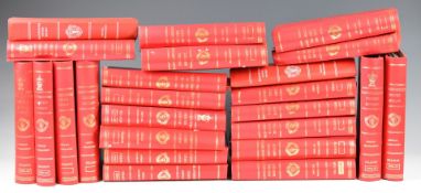 A large collection of Manchester United Review football programmes, many bound in folders, mainly