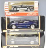 Three Maisto and Majorette diecast model sports cars comprising two 1:18 scale Jaguar XJ220 and a
