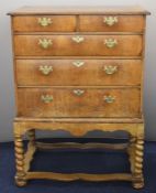 Georgian mahogany chest on stand of two over three graduated drawers with rope twist legs and bun