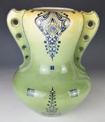 Art Nouveau pottery faїence twin handled vase with impressed mark to base 947, height 31cm