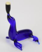 Pirelli Glass blue glass seal balancing a pint of Guinness on its nose, based on the Gilroy designed