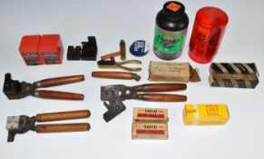A collection of bullet casting and black powder equipment including .44, .36 and .38 twin Keith type