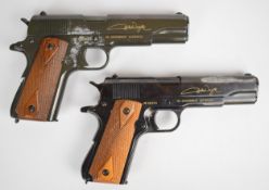 A pair of Franklin Mint John Wayne Armed Forces Commemorative replica Colt 1911 .45 Government
