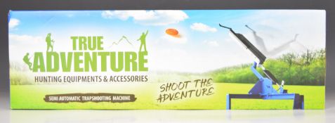 True Adventure semi-automatic clay pigeon trap, in original box.