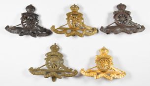Five British Army Royal Artillery cap badges including officer's gilt and Officer's Service Dress