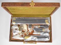 12 bore shotgun cleaning kit with ebony and brass rods, chrome oil bottles etc, unused in hardwood