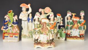 Six 19thC Staffordshire flatback and spill vase figures including The Rocket, tallest 28cm