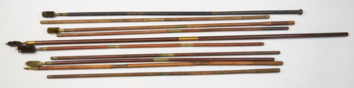 Ten wooden and brass shotgun cleaning rods including ebony and mahogany examples.