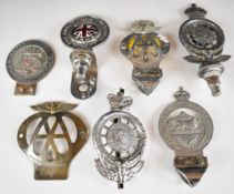 Seven vintage and classic car badges to include AA, RAC, 1951 Association of Police Surgeons of