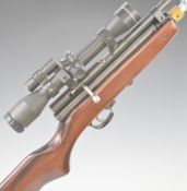 SMK Model XS79 .22 CO2 air rifle with semi-pistol grip, red dot laser sight and SMK 4x32 scope,