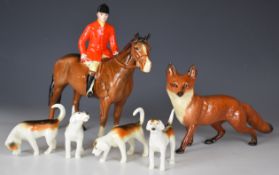 Beswick standing huntsman, four hounds and a large fox