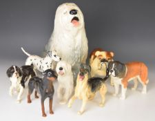 Beswick dog figures including fireside Old English Sheepdog, matt St Bernard, bulldog and