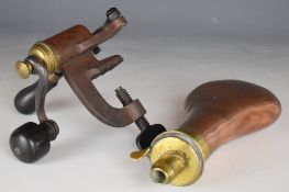 Sykes Extra Quality copper and brass powder flasks and an R Hughes 12 bore shotgun cartridge re-