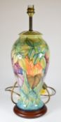 Moorcroft pottery table lamp with geometric green foliage decoration, height without shade 44cm