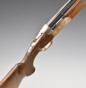 Beretta Ultra Light Deluxe 12 bore over and under ejector shotgun with gold bird engraved locks,