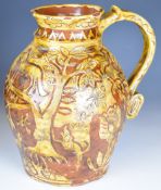 18thC slipware jug with motto 'Ye Fox and Hounds Guide Ale for Ye Harvest' and 'Phillip Burr / Burns