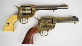 Two Colt style six shot single action revolvers, both with ornate decoration to the frame, USA