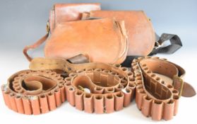 Six vintage brown leather shotgun cartridge bags and belts.