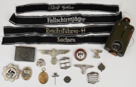Approximately 15 German reproduction cap badges and other insignia
