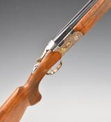 Beretta Ultra Light Deluxe 12 bore over and under ejector shotgun with gold bird engraved locks,