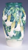 Moorcroft pottery baluster shaped vase by Anji Davenport decorated in the Angels Trumpet pattern,