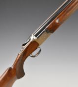 Nikko 20 bore over and under ejector shotgun with engraved locks, underside, fences and thumb lever,