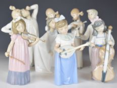 Nine Lladro / Nao figures including five musicians, most boxed, tallest 23cm